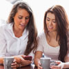 Women use apps on their smartphones